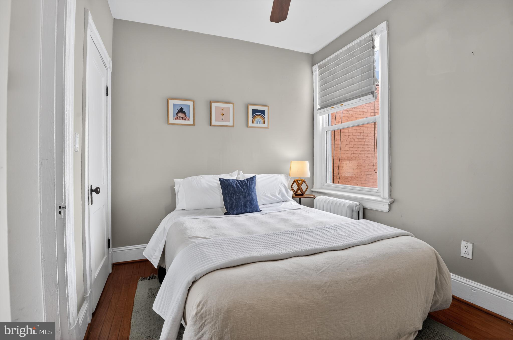 315 16th Street Southeast Washington, DC 20003 - Photo 15 of 21 a bedroom with a bed and a window