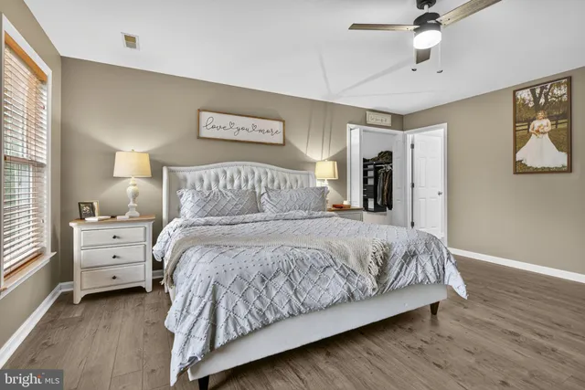 a bedroom with a bed and window