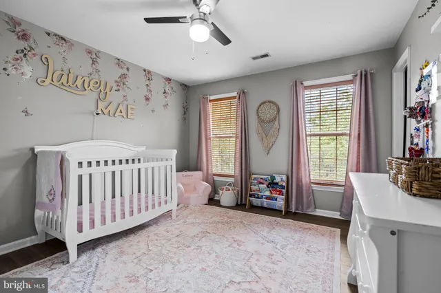 a bedroom with furniture and windows