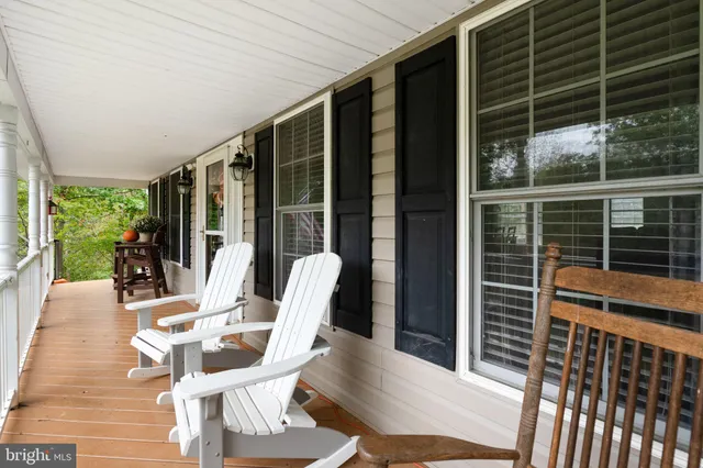 a view of a patio with a table chairs and balcony