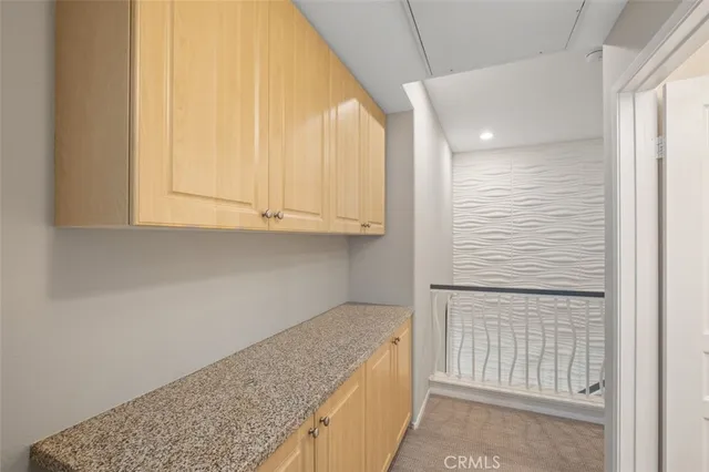 a view of a kitchen cabinets and empty room