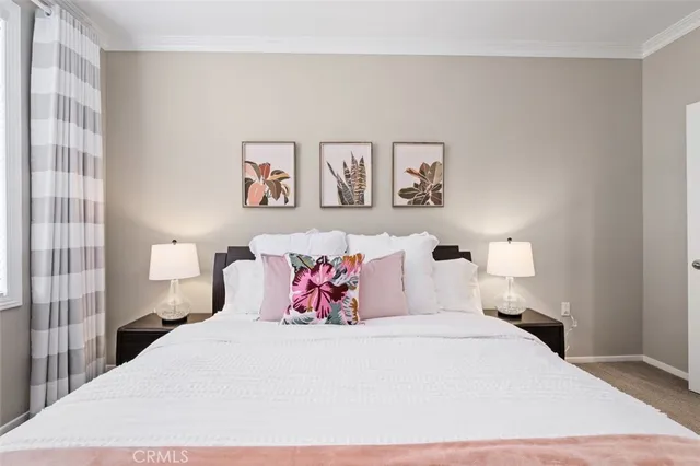 a bedroom with a bed and a lamp