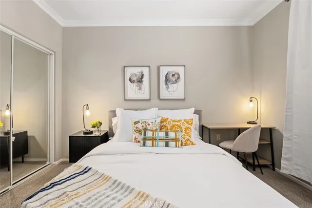 a bedroom with bed and window