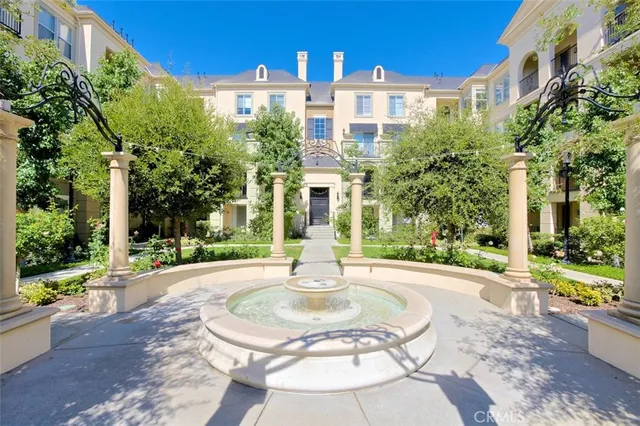 front view of a house with a street and trees