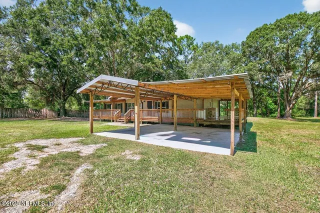 a kitchen with stainless steel appliances kitchen island granite countertop a stove and cabinets