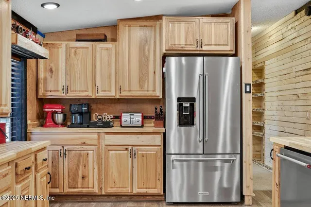 a bedroom with a bed window and wall painting