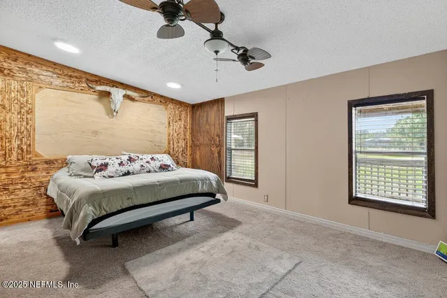 a kitchen with stainless steel appliances kitchen island granite countertop a stove a sink and a microwave