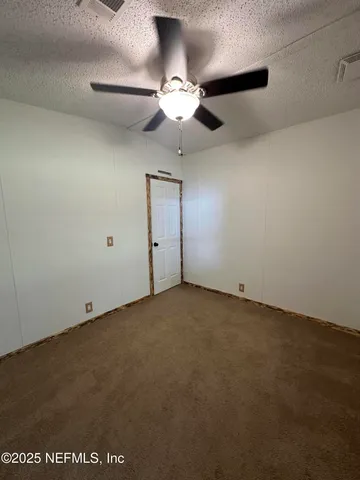 a view of a forest with a houses