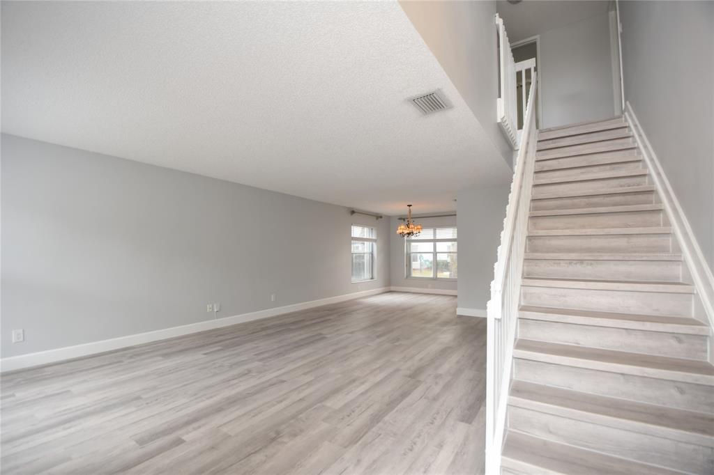 4801 Grapevine Way, Unit 4801 Davie, FL 33331 - Photo 18 of 38 a view of entryway and hall with wooden floor