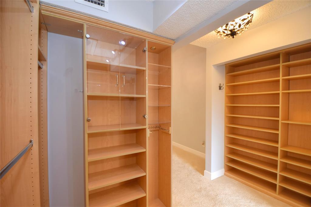4801 Grapevine Way, Unit 4801 Davie, FL 33331 - Photo 22 of 38 a view of walk in closet with empty racks