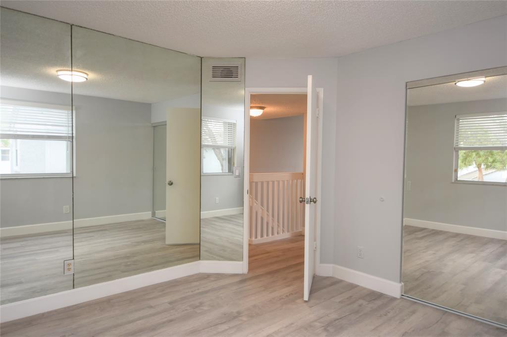 4801 Grapevine Way, Unit 4801 Davie, FL 33331 - Photo 31 of 38 an empty room with wooden floor and windows