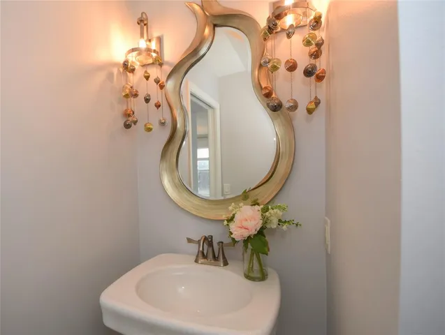 a bathroom with a sink and mirror