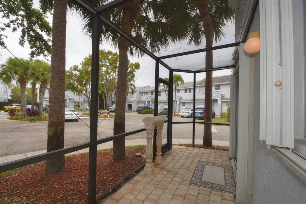4801 Grapevine Way, Unit 4801 Davie, FL 33331 - Photo 34 of 38 a view of a porch with a backyard
