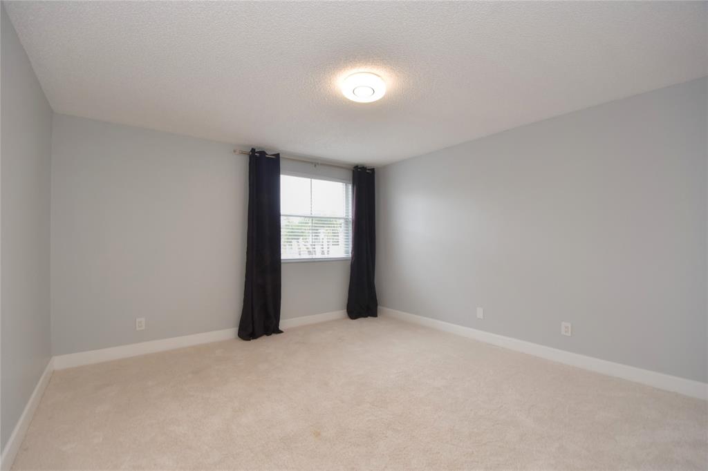 4801 Grapevine Way, Unit 4801 Davie, FL 33331 - Photo 9 of 38 an empty room with windows and closet