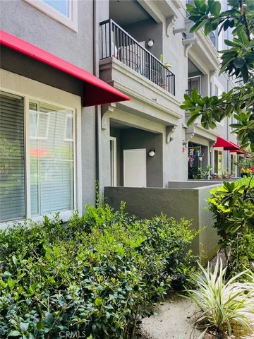 a front view of a house with a flower garden