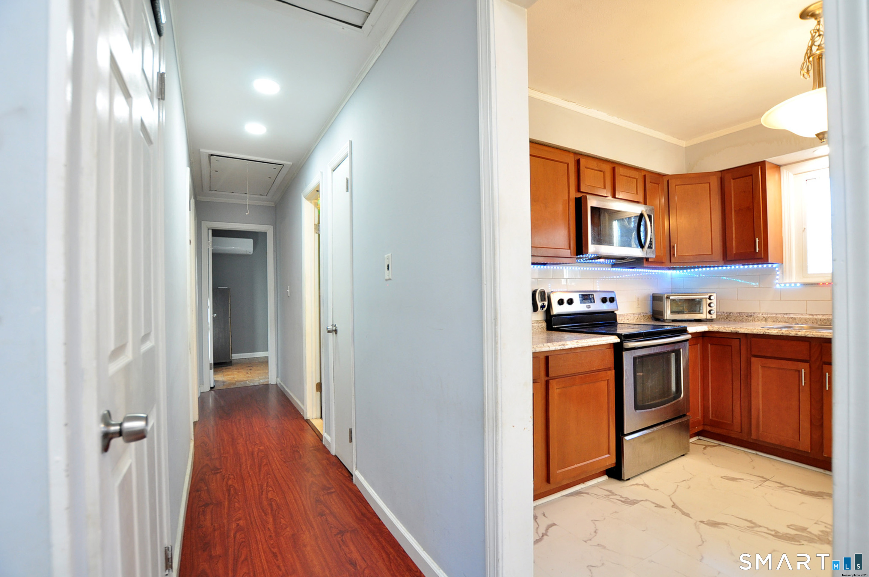 8 Cornfield Road Waterbury, CT 06704 - Photo 18 of 39 a kitchen with stainless steel appliances granite countertop a refrigerator and a sink