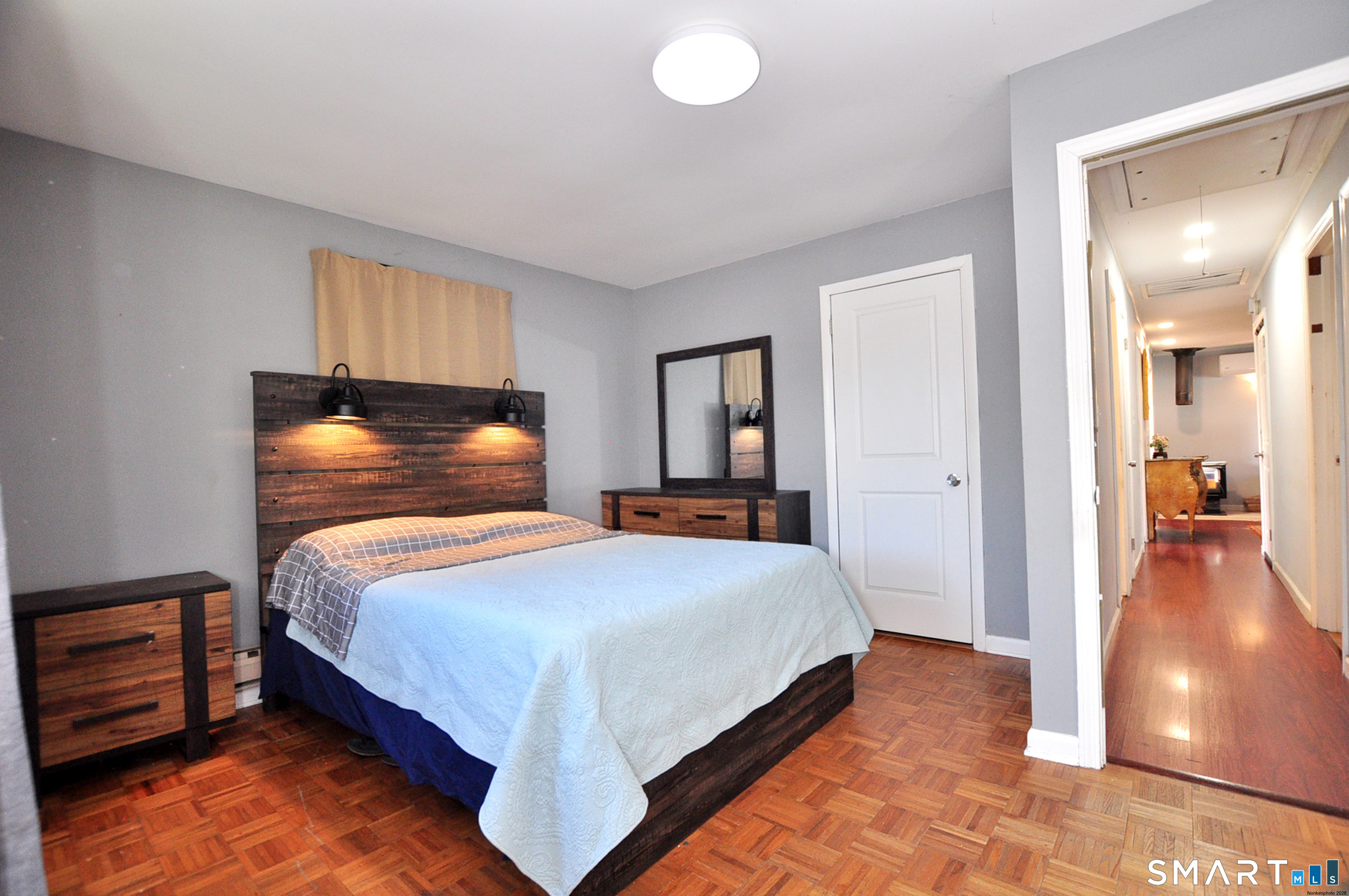 8 Cornfield Road Waterbury, CT 06704 - Photo 21 of 39 a bedroom with bed and walk in closet with wooden floor