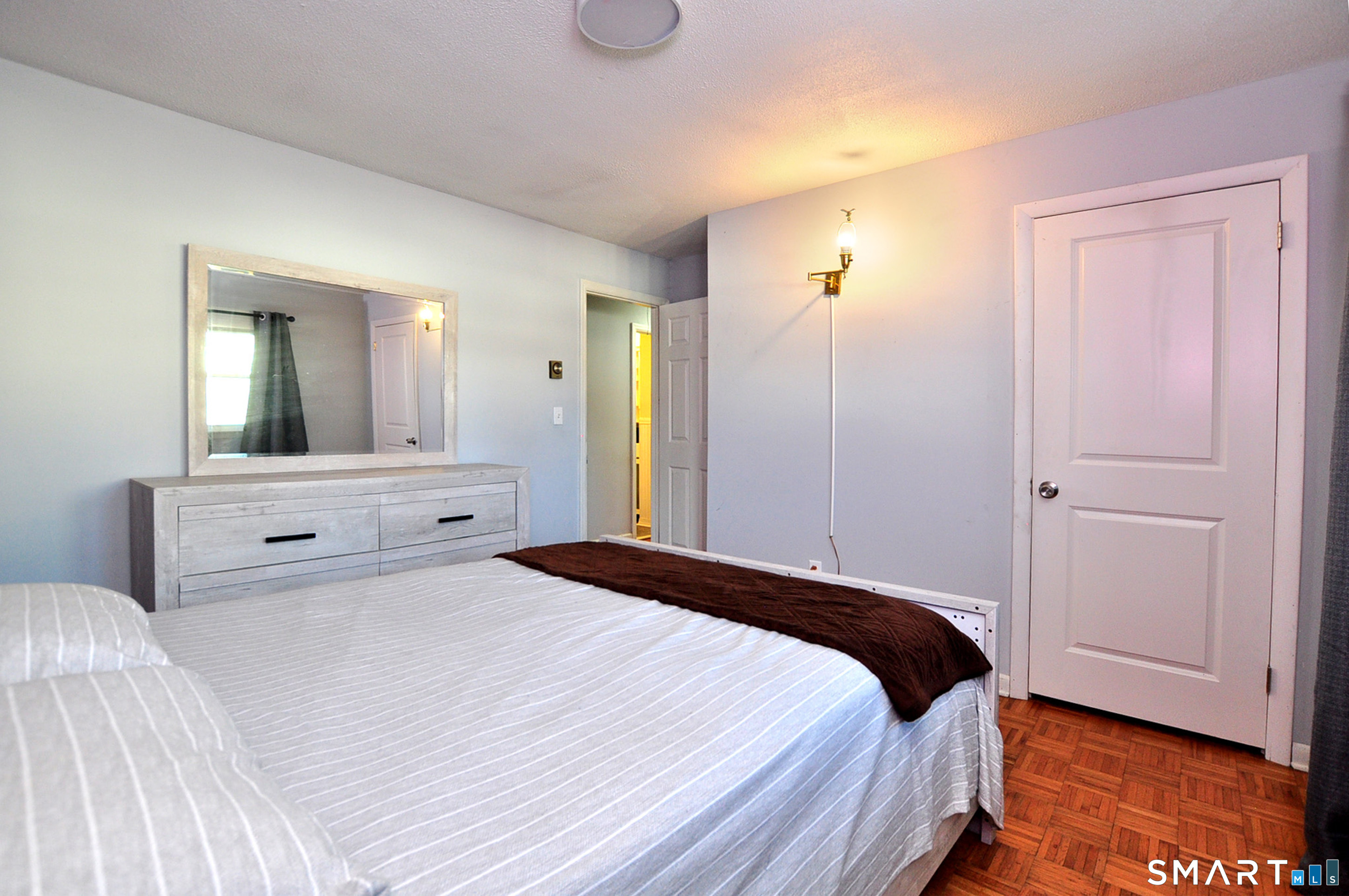 8 Cornfield Road Waterbury, CT 06704 - Photo 27 of 39 a bedroom with a bed and a mirror