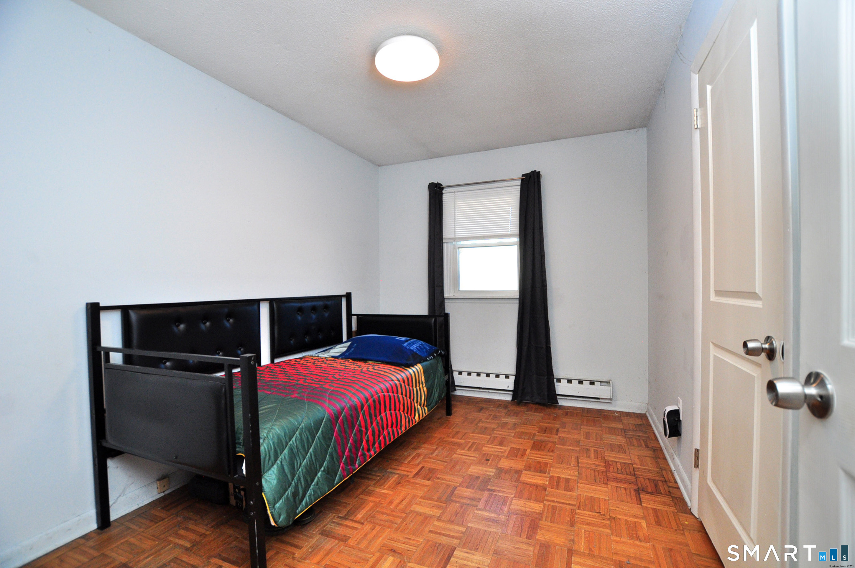 8 Cornfield Road Waterbury, CT 06704 - Photo 30 of 39 a bedroom with a bed and window