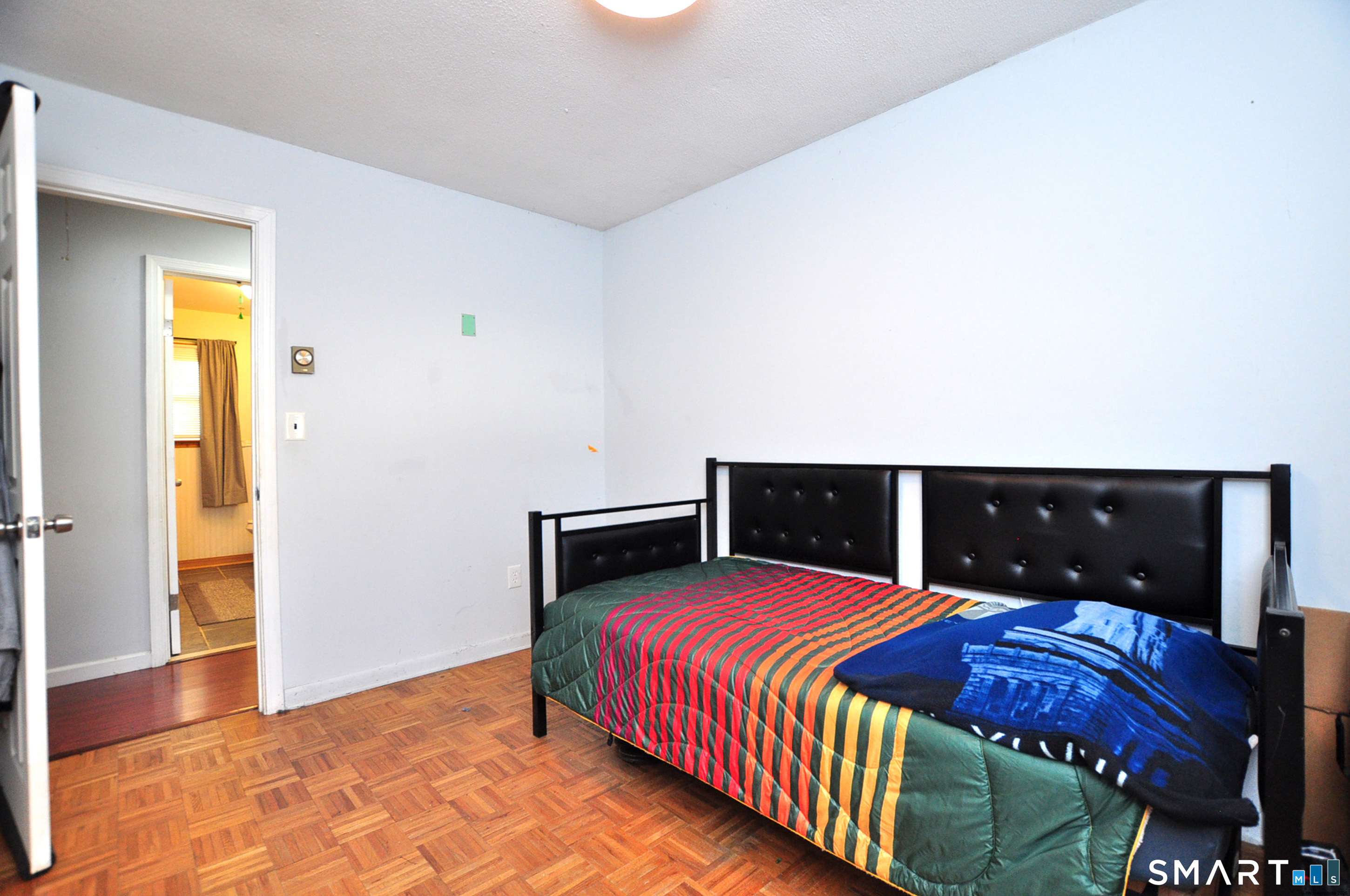 8 Cornfield Road Waterbury, CT 06704 - Photo 31 of 39 a bedroom with a bed and a view of balcony