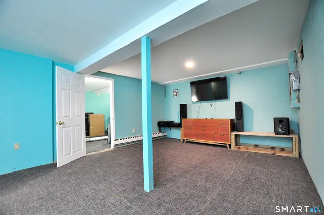 a bedroom with furniture and window