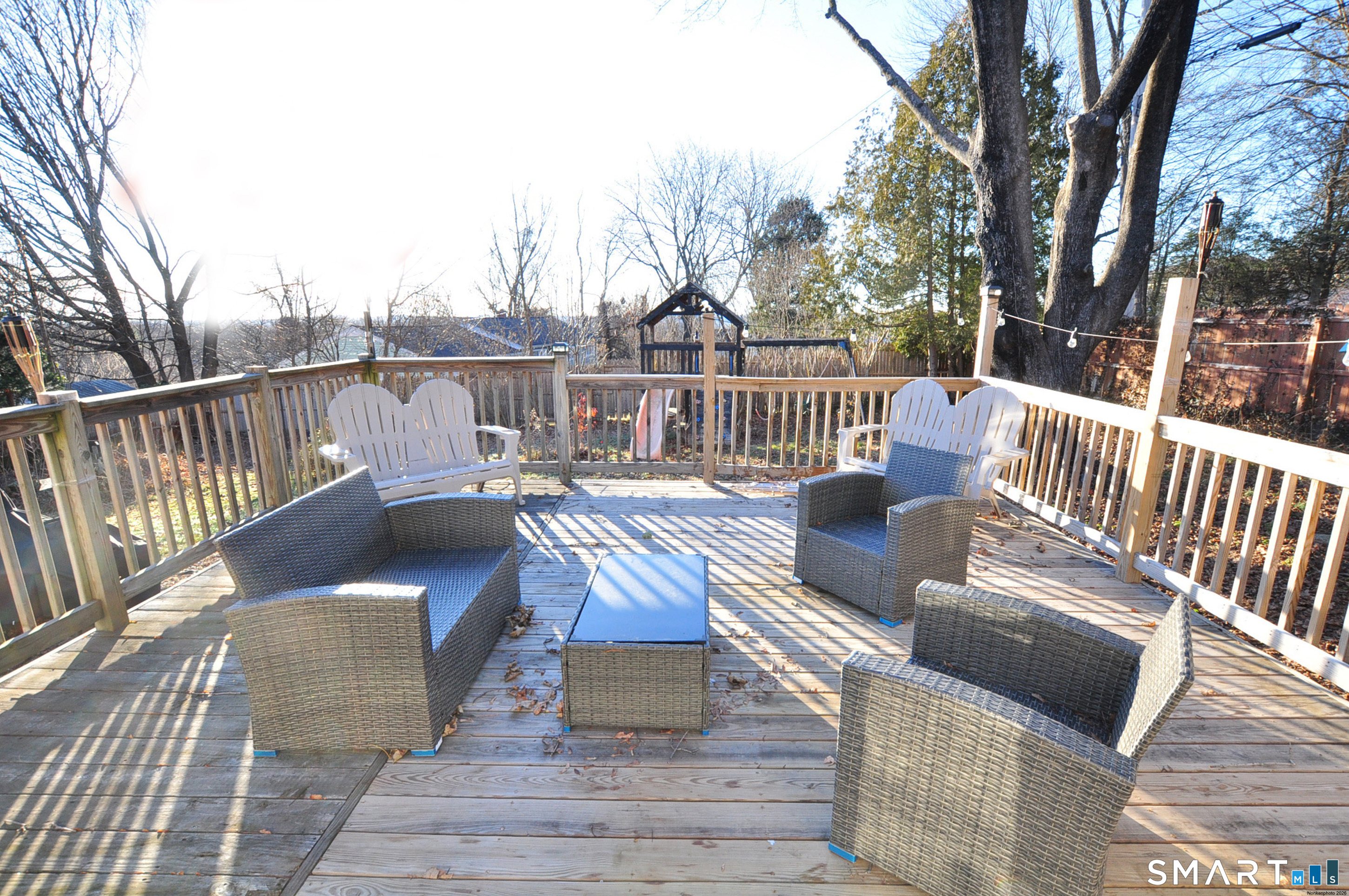 8 Cornfield Road Waterbury, CT 06704 - Photo 35 of 39 a view of a deck with two couches chairs and wooden floor