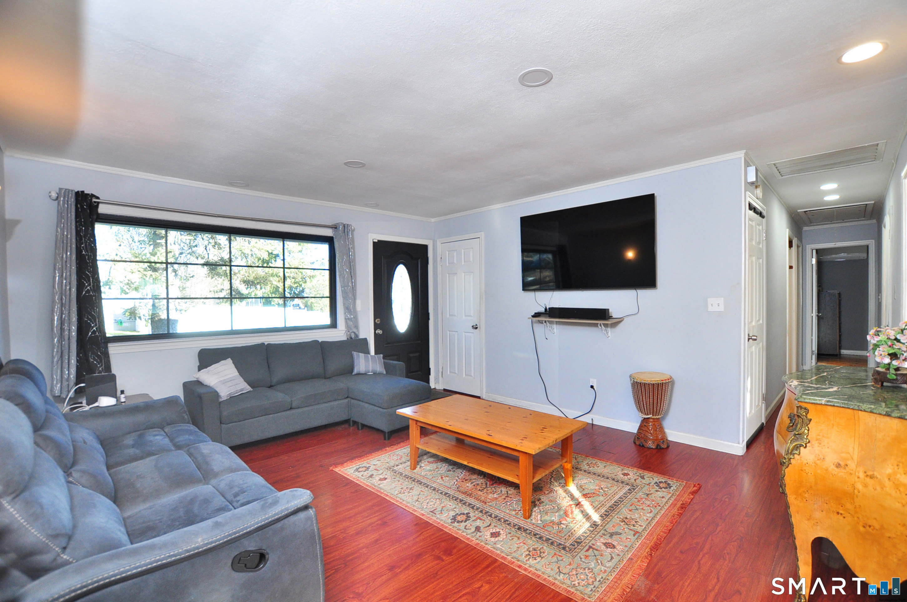 8 Cornfield Road Waterbury, CT 06704 - Photo 4 of 39 a living room with furniture and a flat screen tv