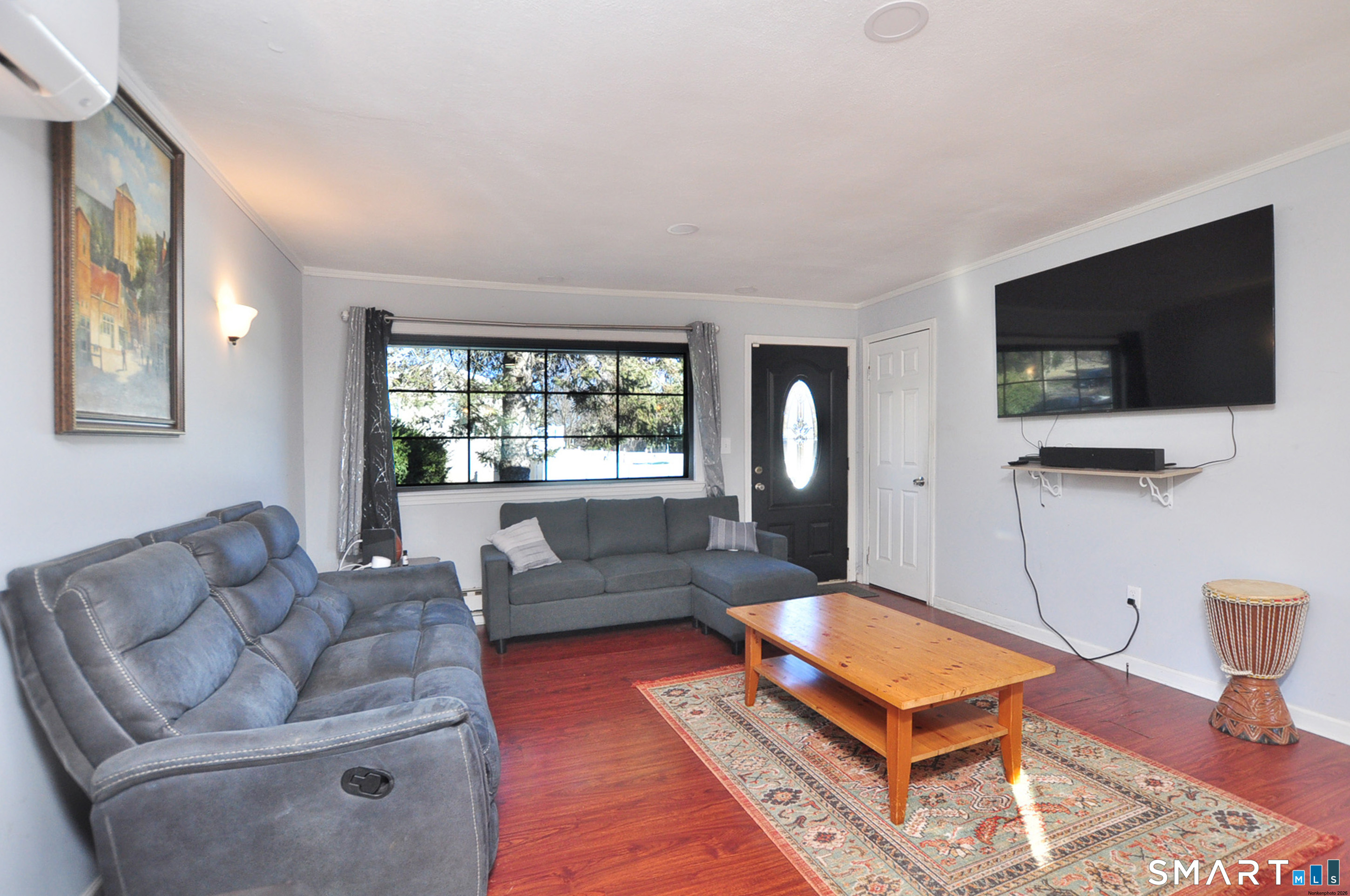 8 Cornfield Road Waterbury, CT 06704 - Photo 6 of 39 a living room with furniture and a flat screen tv