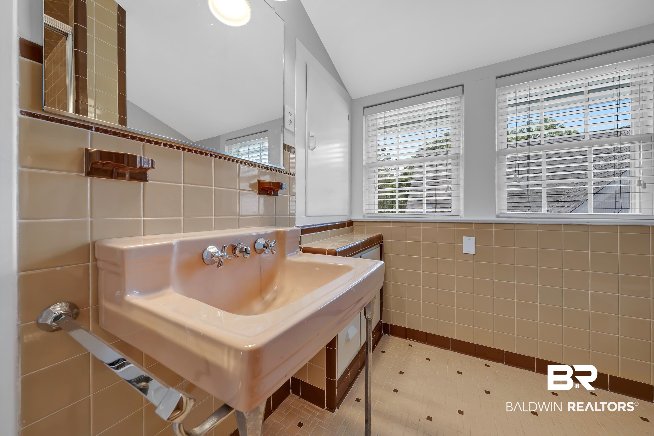 43199 Pine Grove Road Bay Minette, AL 36507 - Photo 58 of 71 Bathroom featuring a pedestal sink, tiled walls, and two windows