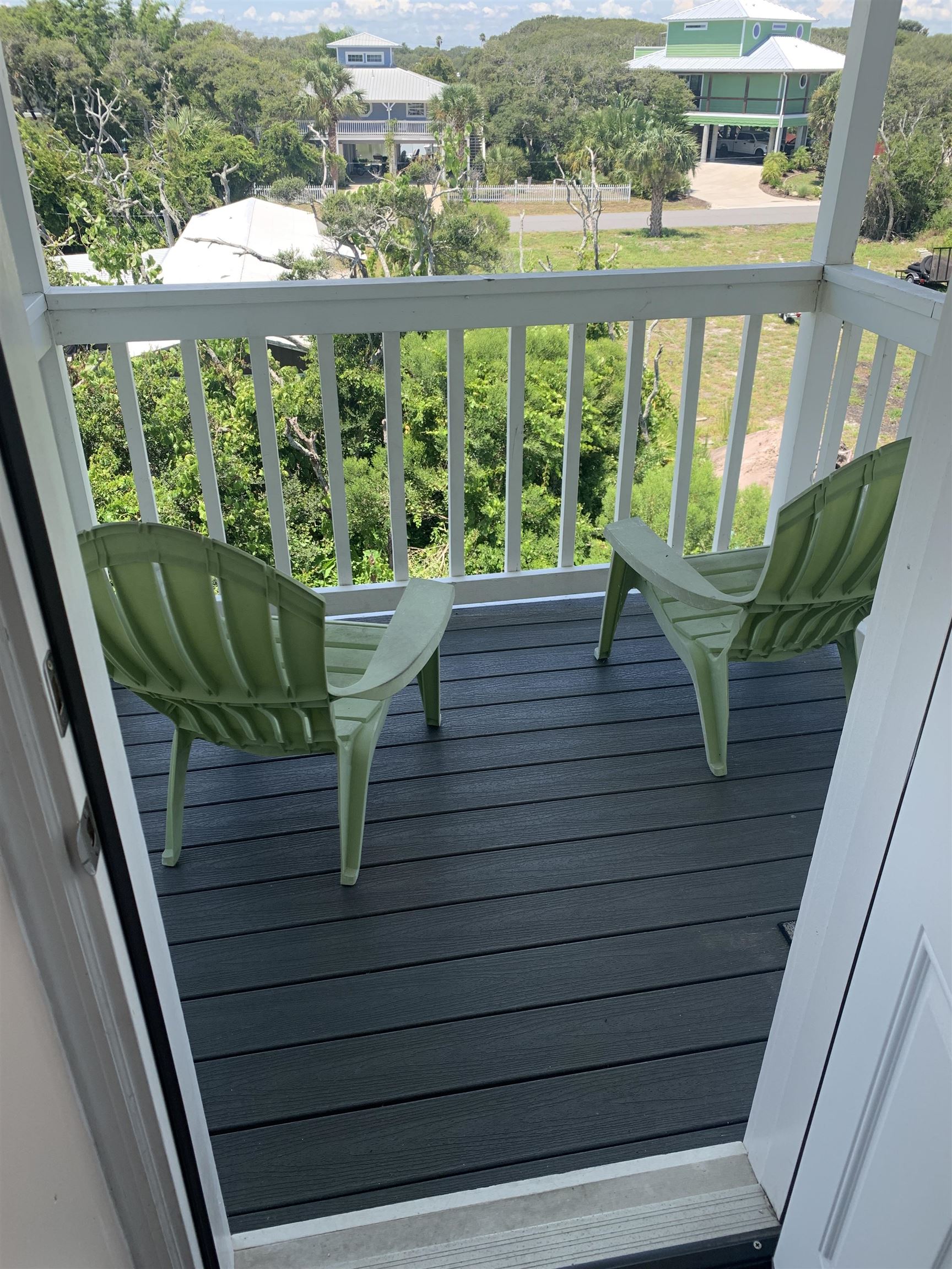 6225 A1A South, Unit D St. Augustine, FL 32080 - Photo 11 of 11 a view of a balcony with lake view and a wooden floor