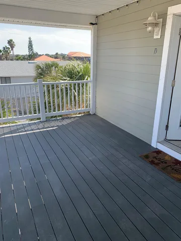 a view of deck with wooden floor and fence