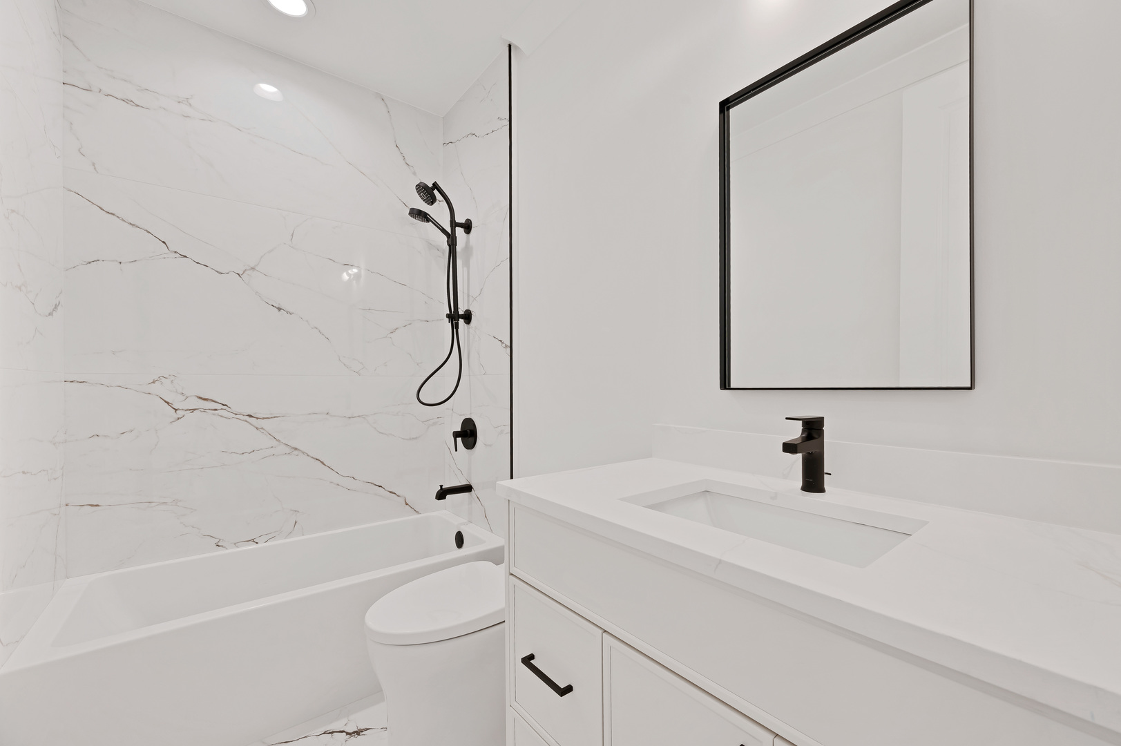 1404 West George Street, Unit 1 Chicago, IL 60657 - Photo 12 of 12 a bathroom with a sink a toilet and a bathtub