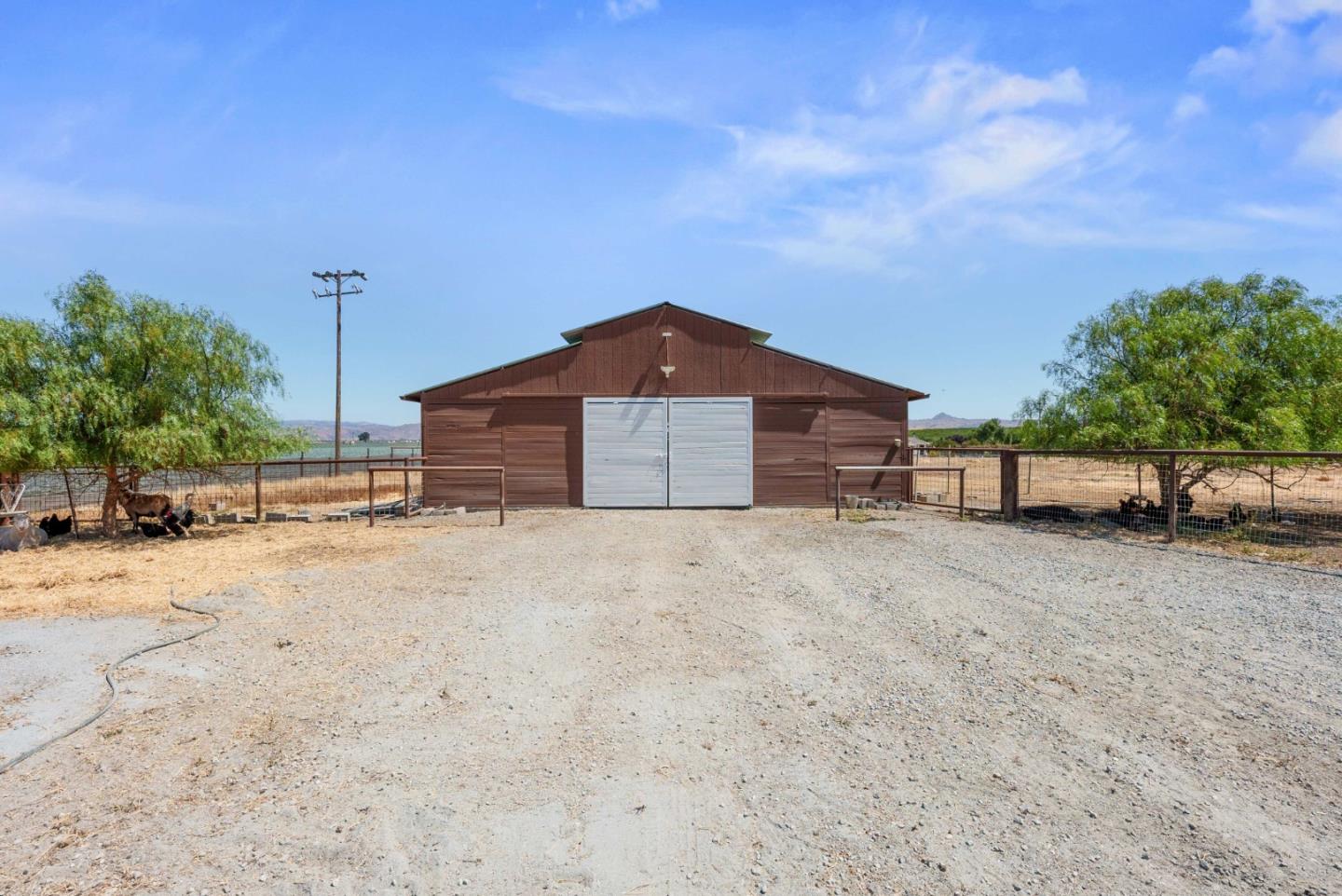1150 Wright Road Hollister, CA 95023 - Photo 26 of 68 a front view of a house with a yard and garage