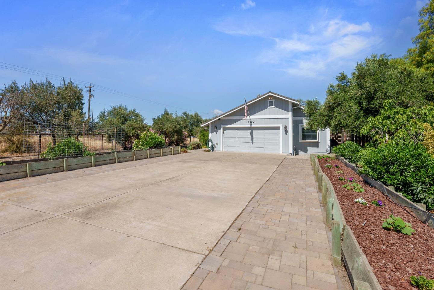 1150 Wright Road Hollister, CA 95023 - Photo 3 of 68 a front view of a house with a yard and trees