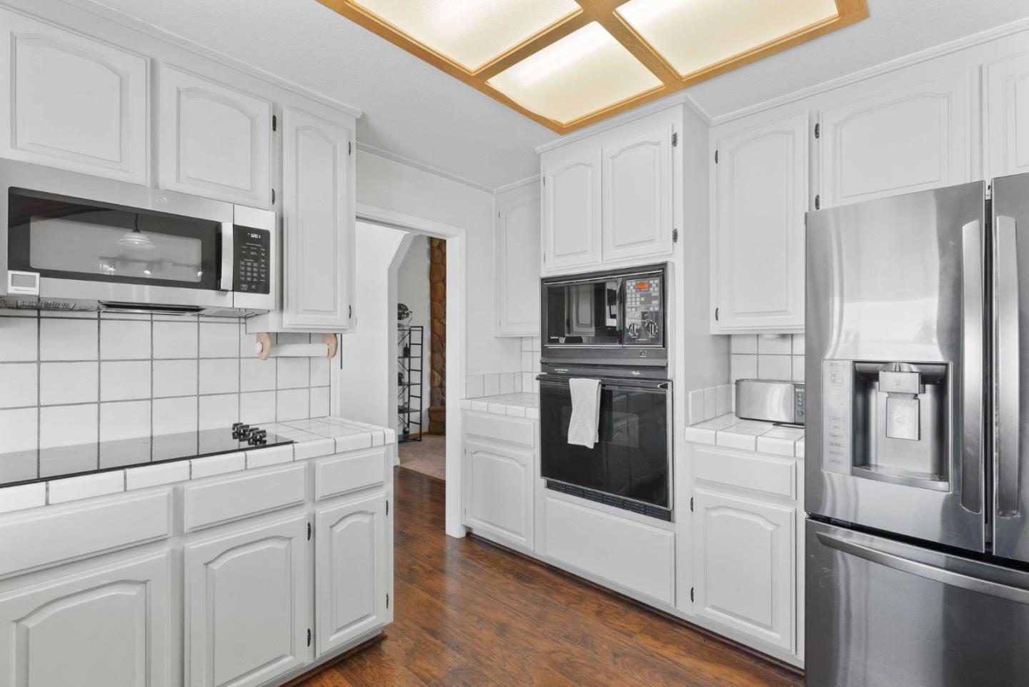 1150 Wright Road Hollister, CA 95023 - Photo 37 of 68 a kitchen with stainless steel appliances a refrigerator stove and microwave