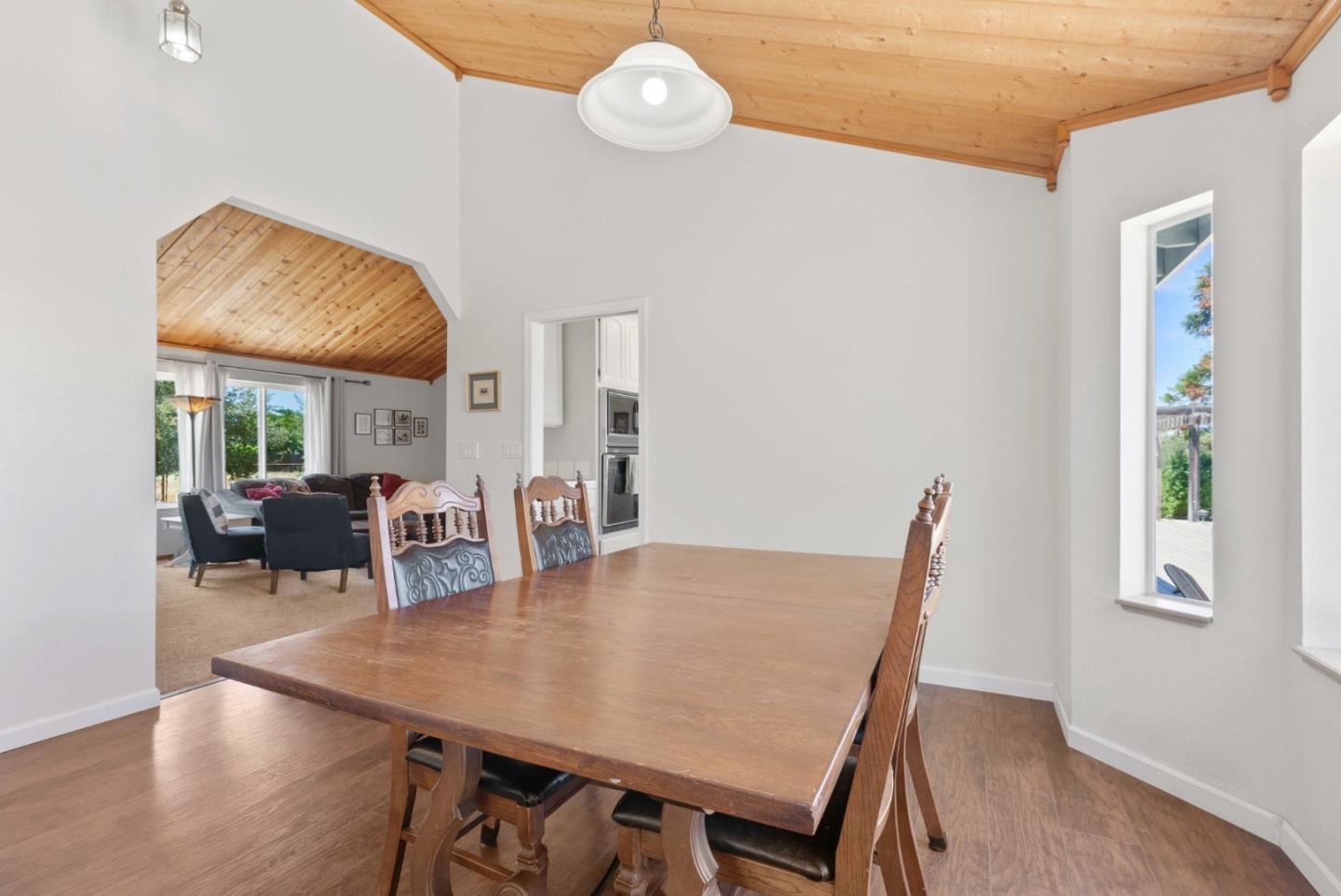 1150 Wright Road Hollister, CA 95023 - Photo 44 of 68 a view of a dining room with furniture window and wooden floor