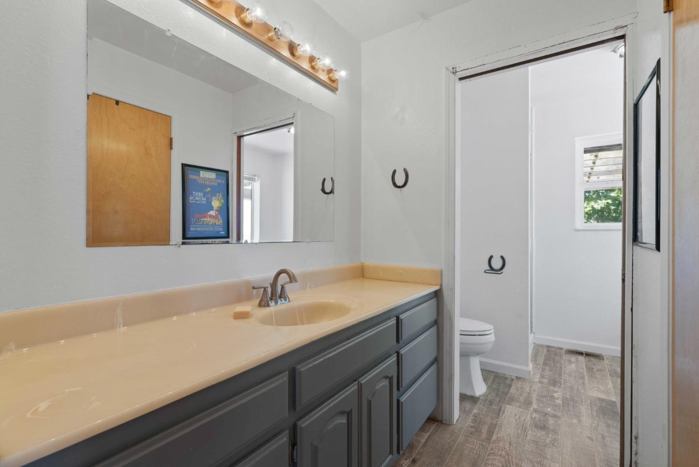 1150 Wright Road Hollister, CA 95023 - Photo 51 of 68 a bathroom with a sink a toilet and shower