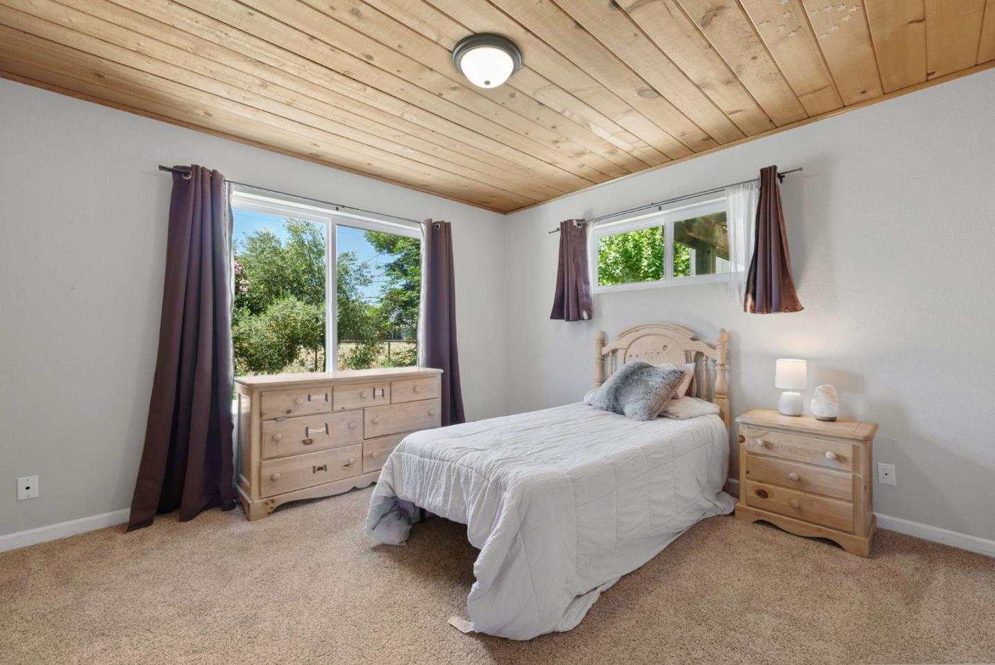 1150 Wright Road Hollister, CA 95023 - Photo 55 of 68 a bedroom with a bed and a large window