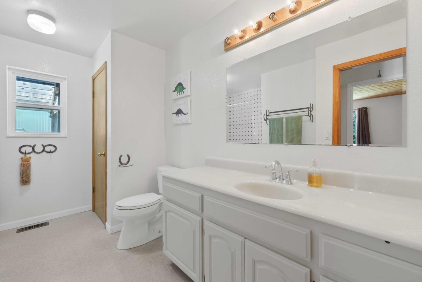 1150 Wright Road Hollister, CA 95023 - Photo 58 of 68 a bathroom with a sink a toilet and shower