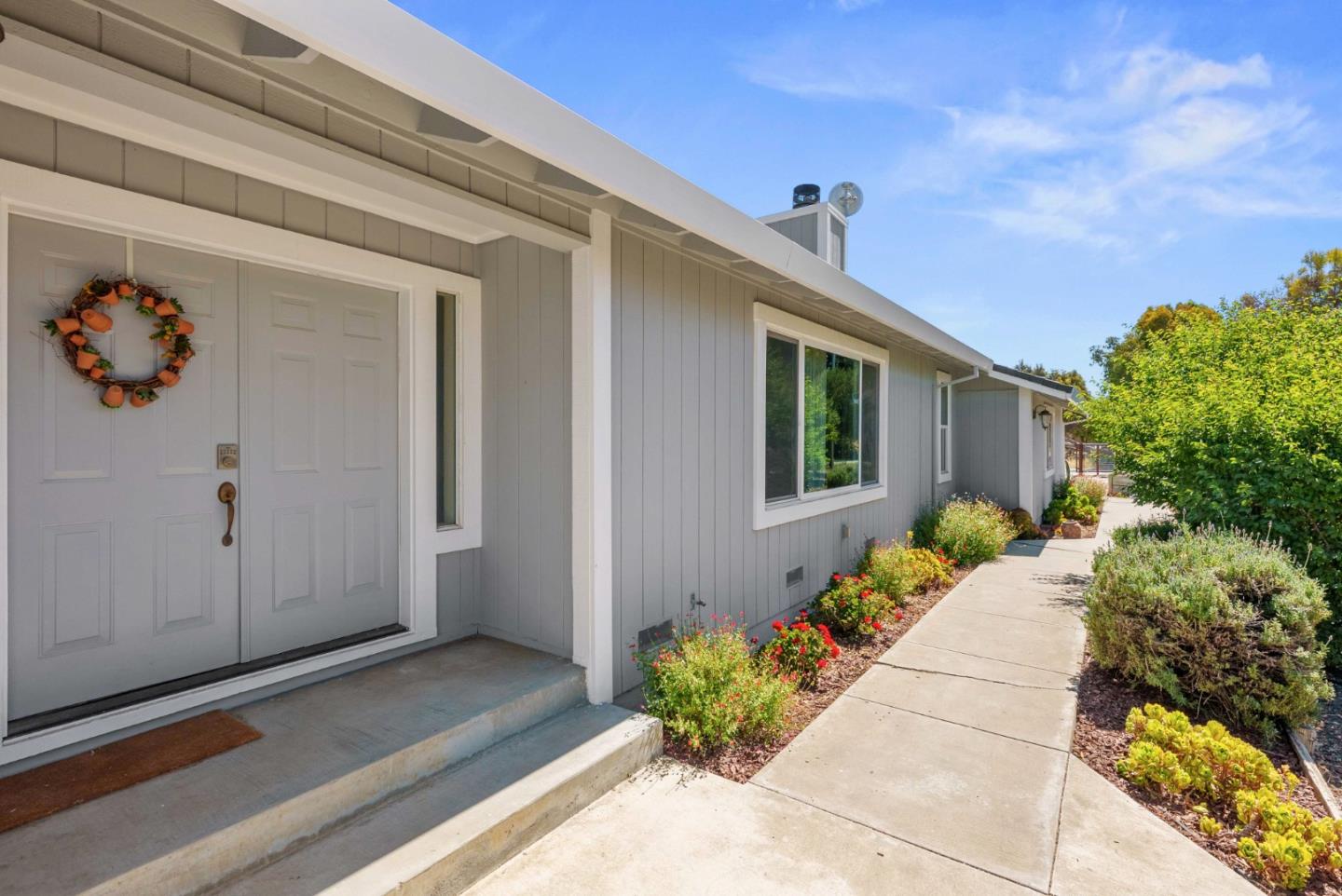 1150 Wright Road Hollister, CA 95023 - Photo 6 of 68 a front view of a house with a yard