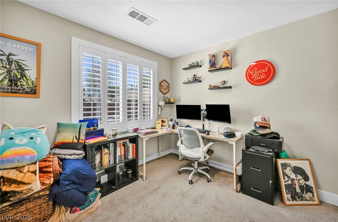 1234 Sunfire Street Henderson, NV 89014 - Photo 20 of 40 A well-lit home office area provides a dedicated space for productivity and organization.