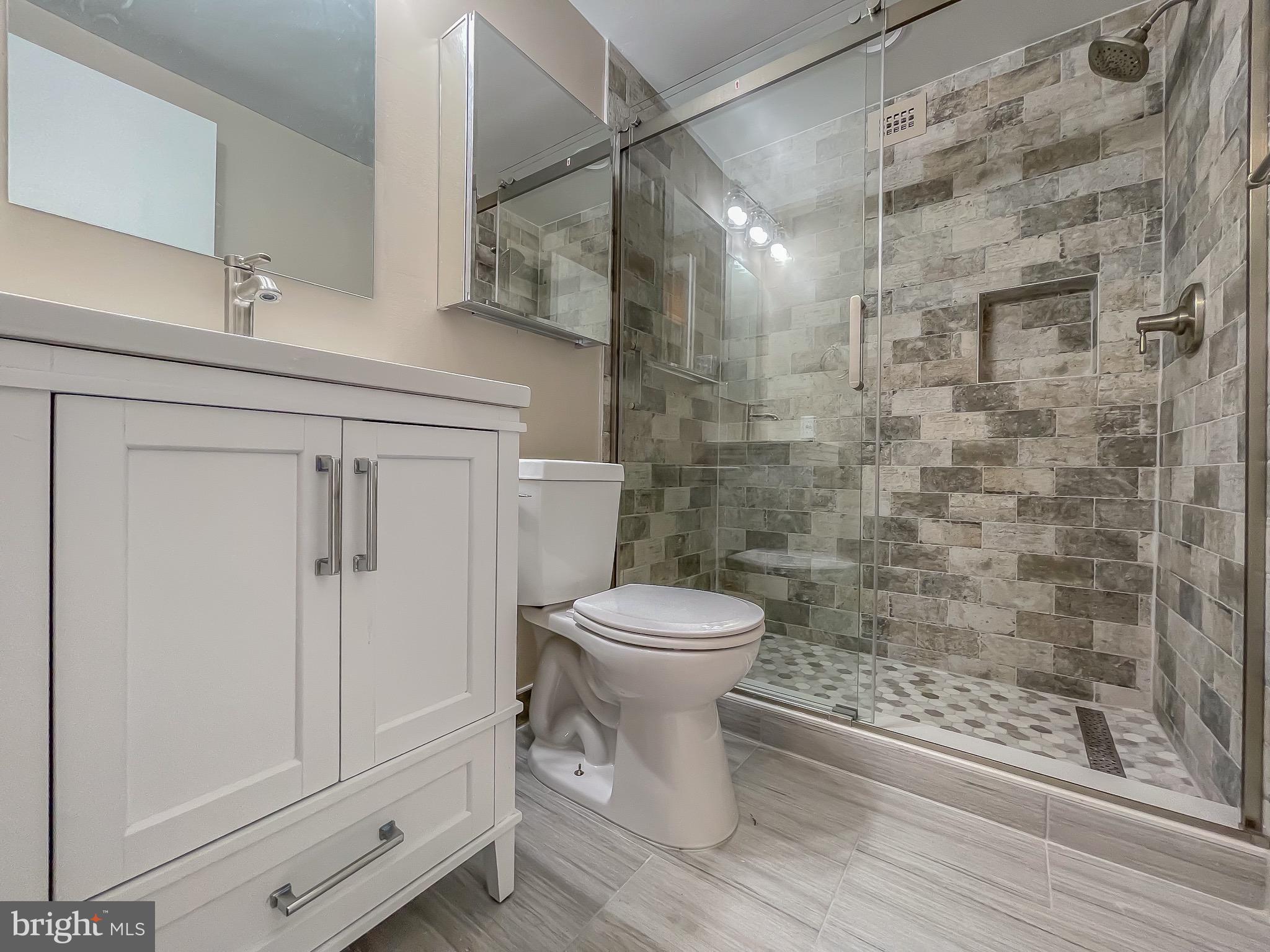 3245 Rio Drive, Unit 610 Falls Church, VA 22041 - Photo 16 of 27 a bathroom with a toilet a sink and shower