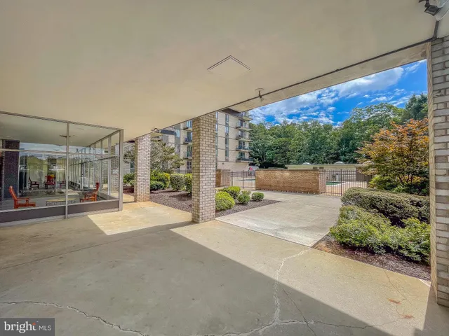 a swimming pool with outdoor seating and yard