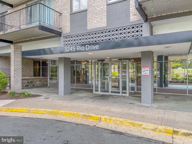 a view of a house with a swimming pool and porch