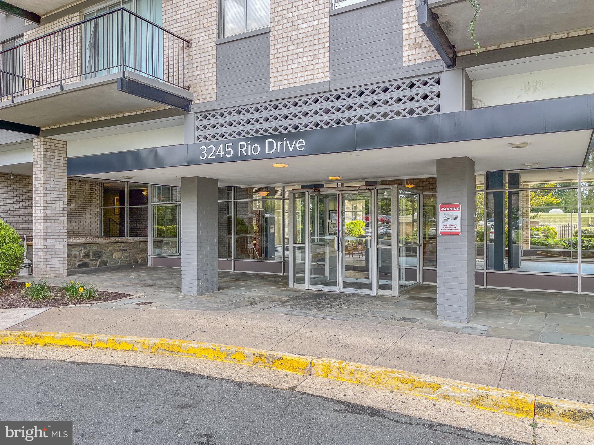 3245 Rio Drive, Unit 610 Falls Church, VA 22041 - Photo 3 of 27 a view of a house with a swimming pool and porch