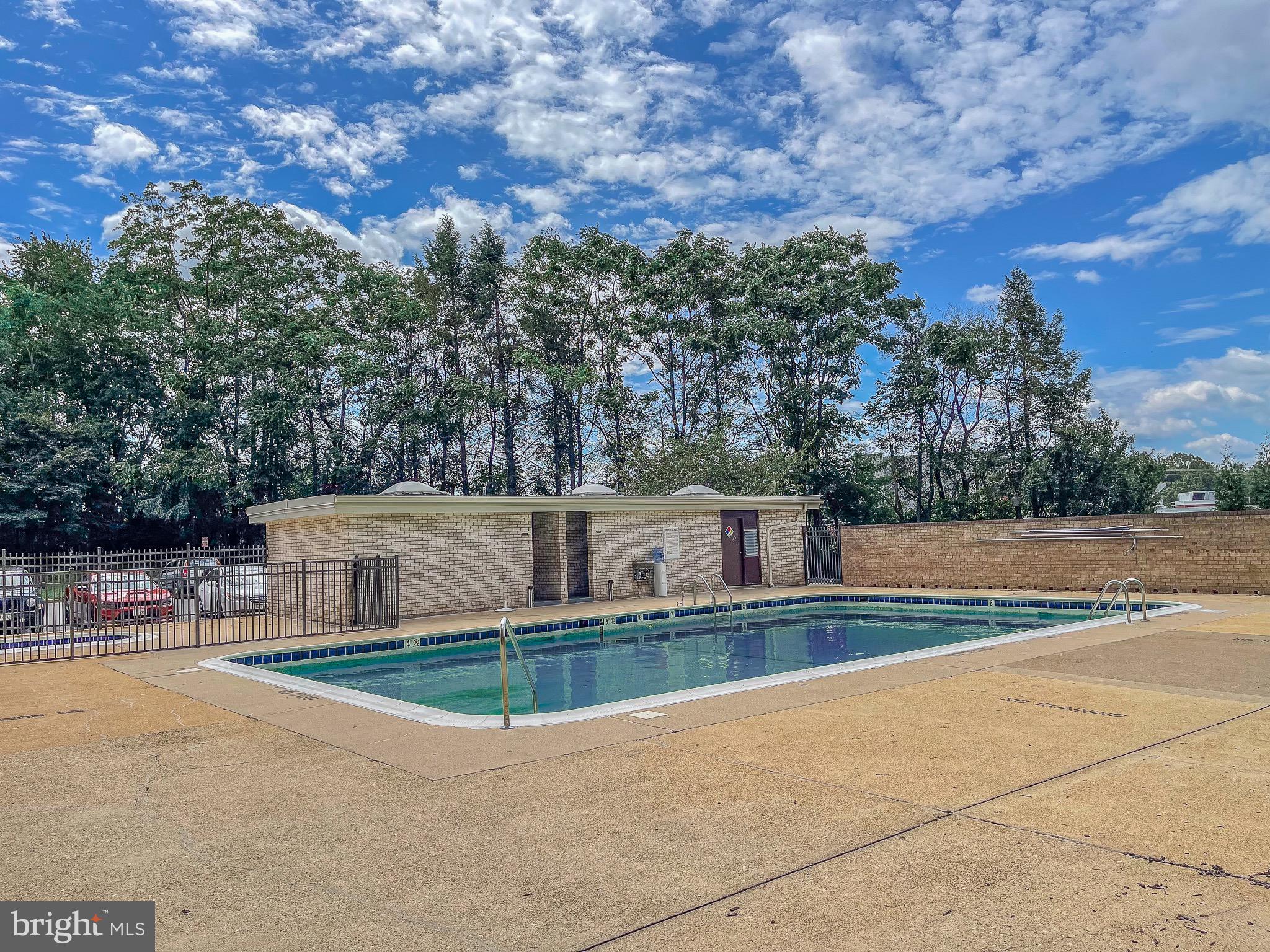 3245 Rio Drive, Unit 610 Falls Church, VA 22041 - Photo 4 of 27 a view of a house with a swimming pool