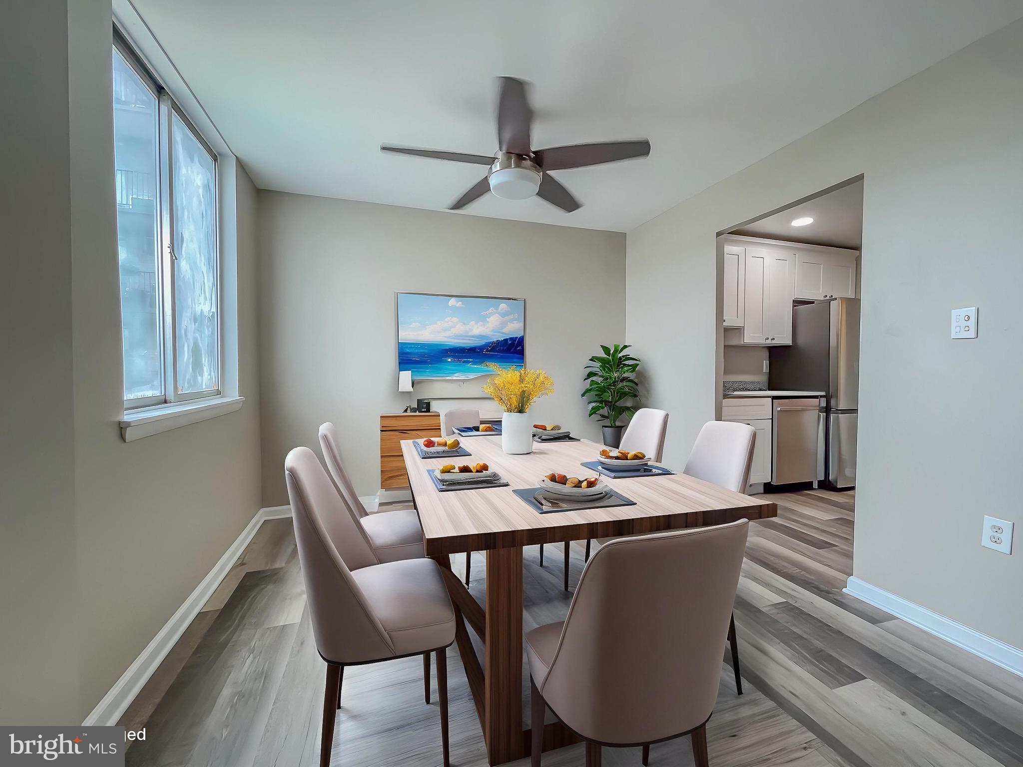 3245 Rio Drive, Unit 610 Falls Church, VA 22041 - Photo 6 of 27 a dining room with furniture a window and wooden floor