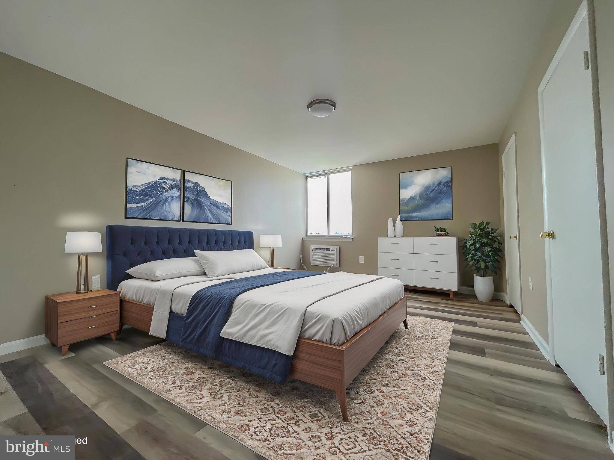 3245 Rio Drive, Unit 610 Falls Church, VA 22041 - Photo 7 of 27 a bedroom with a large bed and a chandelier