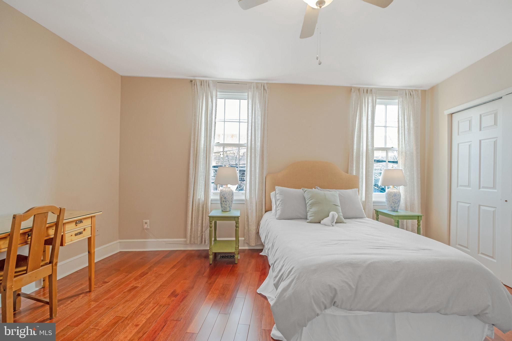 908 South Front Street Philadelphia, PA 19147 - Photo 20 of 27 a bedroom with a bed and wooden floor