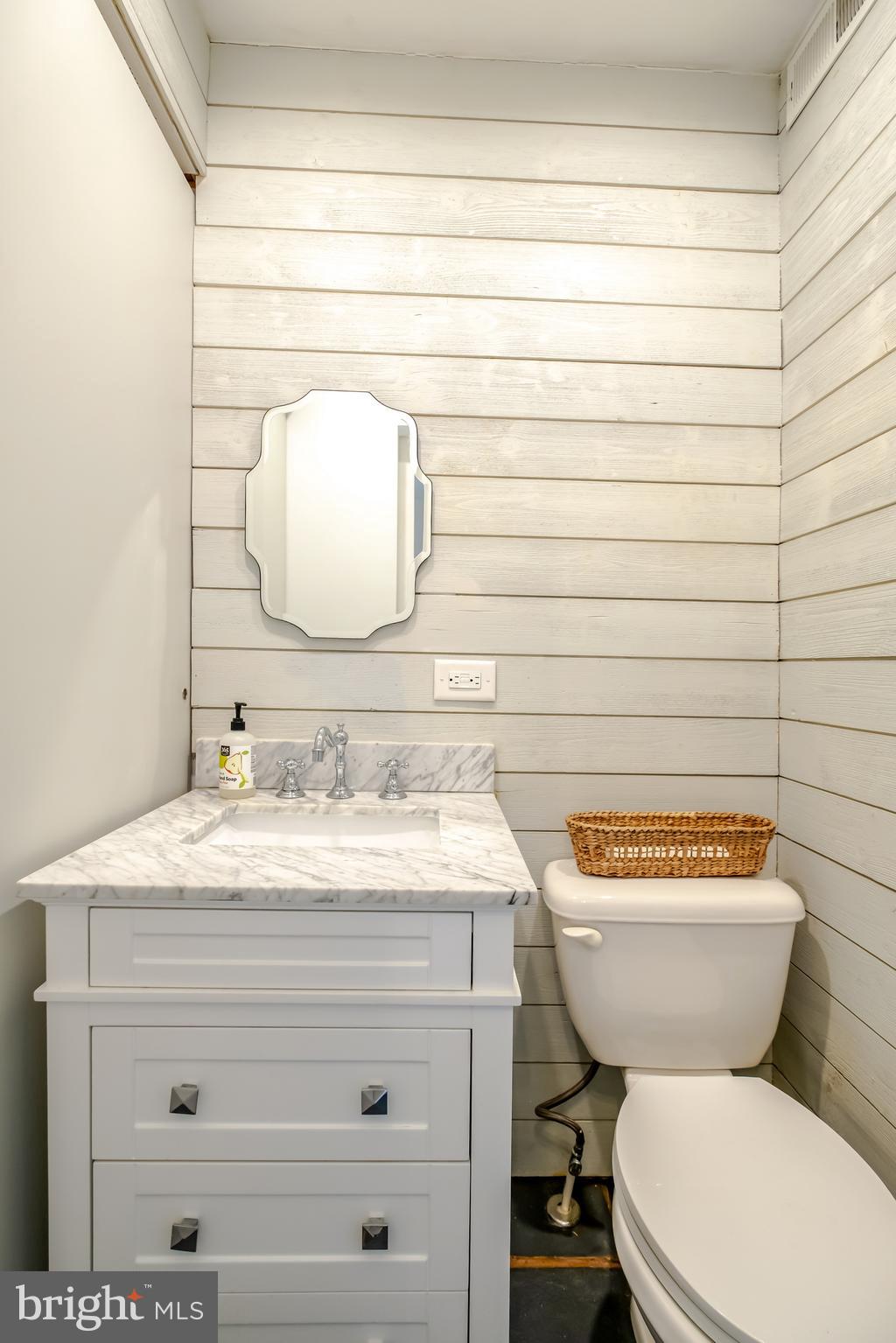 908 South Front Street Philadelphia, PA 19147 - Photo 10 of 27 a bathroom with a toilet sink and mirror